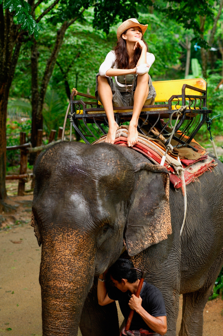 Woman Riding Elephant